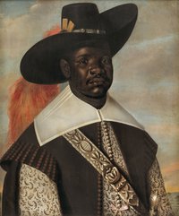 Black man richly-dressed with gold-embroidered shirt and tooled sword belt; also wide-brimmed black hat with large orange feather decoration